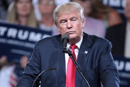 Donald Trump DJs after a woman faints at his rally