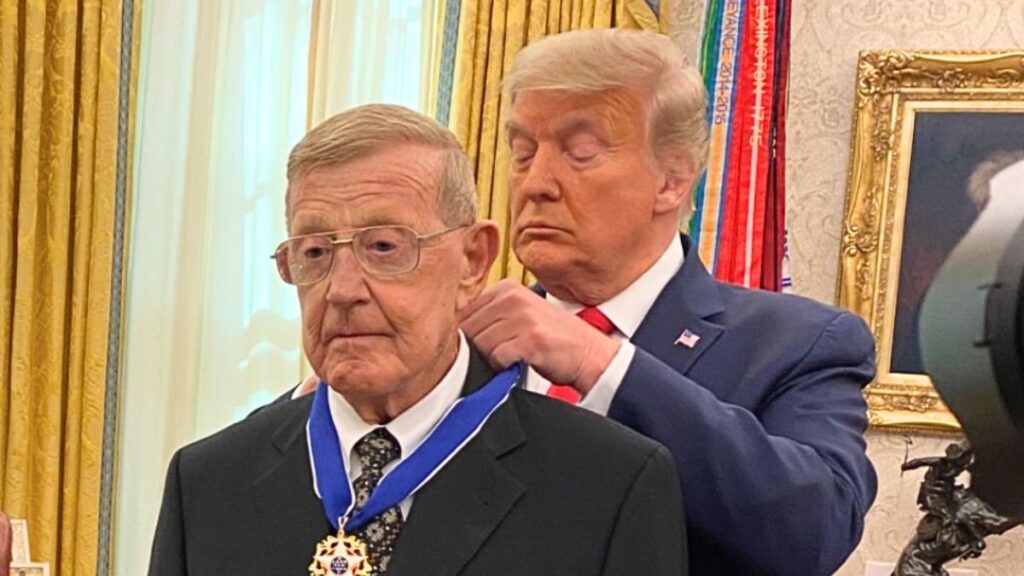Donald Trump awarding Lou Holtz the Presidential Medal of Freedom during a White House ceremony