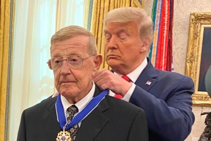 Donald Trump awarding Lou Holtz the Presidential Medal of Freedom during a White House ceremony