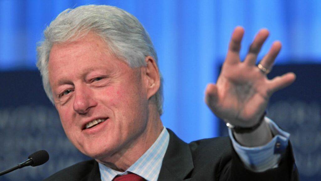 New clip shows Bill Clinton smiling while reviewing Epstein documents during deposition. (by World Economic Forum|via Flickr).