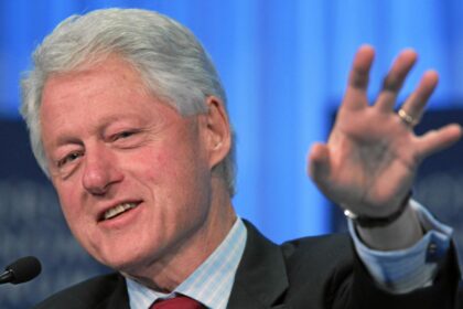 New clip shows Bill Clinton smiling while reviewing Epstein documents during deposition. (by World Economic Forum|via Flickr).