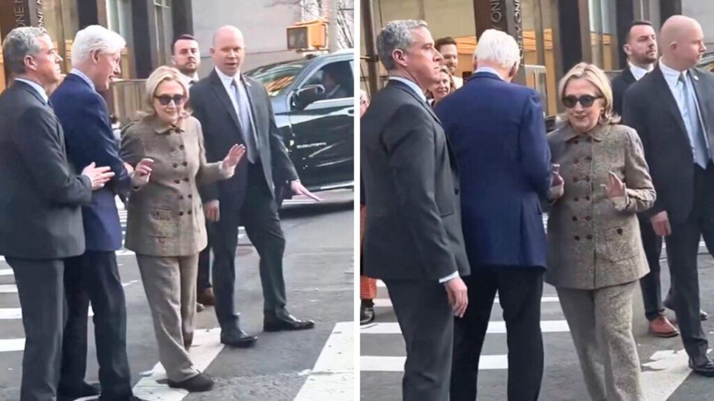 Bill Clinton grins after pushing Hillary Clinton on busy New York street