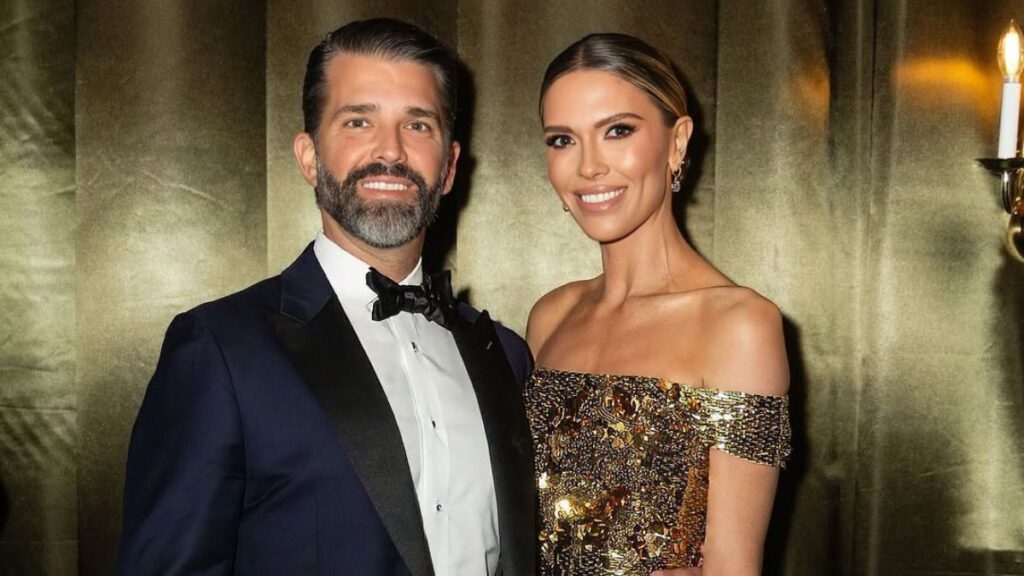 Donald Trump Jr. and Bettina Anderson posing