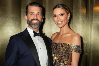 Donald Trump Jr. and Bettina Anderson posing