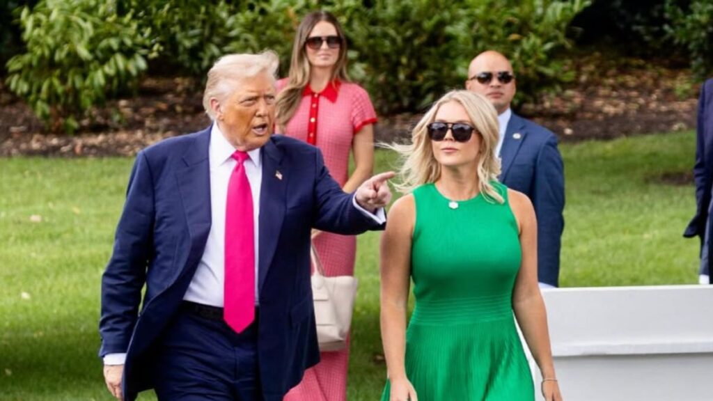 Karoline Leavitt walking beside Donald Trump at the white house garden