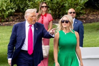 Karoline Leavitt walking beside Donald Trump at the white house garden