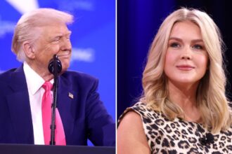 President Donald Trump gestured toward Karoline Leavitt during an Oval Office exchange on media coverage