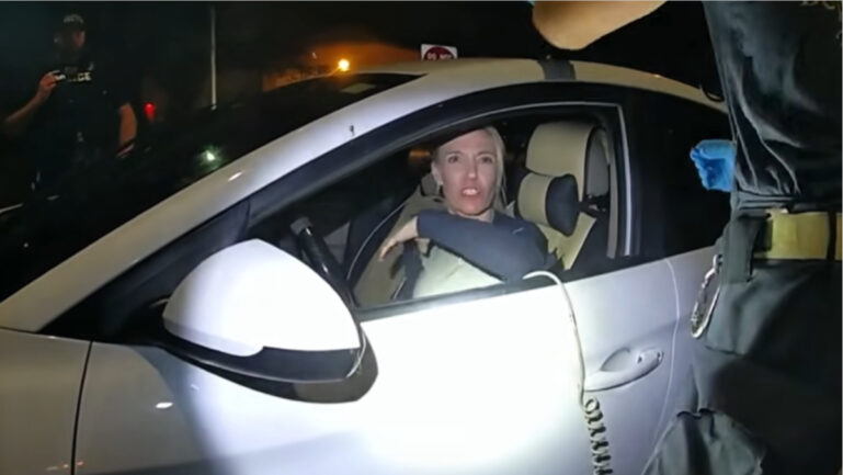 Police Bodycam Shows Woman Calling Officer a ‘Powerpuff Guy’ and Spitting on Him